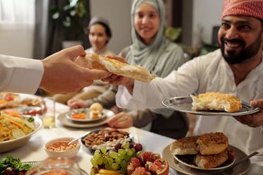 A family has an Iftar meal. (Envato)