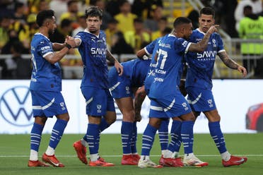 Hilal's Brazilian forward #11 Marcos Leonardo (2nd-L) celebrates scoring his team's first goal during the Saudi Pro League football match between Al-Ittihad and Al-Hilal at King Abdullah Sports City in Jeddah on February 22, 2025. (AFP)