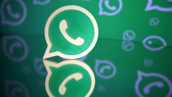 A 3D printed Whatsapp logo is seen in front of a displayed Whatsapp logo in this illustration September 14, 2017. REUTERS/Dado Ruvic