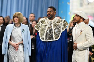 Vogue Editor-in-Chief Anna Wintour (L), US actor Colman Domingo (C), and race car driver Lewis Hamilton (R) arrive for the 2025 Met Gala at the Metropolitan Museum of Art on May 5, 2025, in New York. The Gala raises money for the Metropolitan Museum of Art's Costume Institute. (AFP)