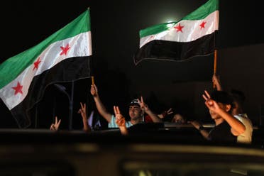 People celebrate in Damascus' Omeyyad square after US President Donald Trump's decision to lift sanctions in Syria, on May 13, 2025. (AFP)