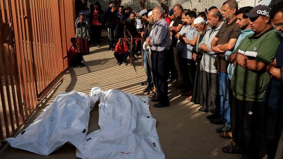 Mourners pray near the bodies of Palestinians killed, in what the Gaza health ministry say was Israeli fire near a distribution site in Rafah, at Nasser hospital in Khan Younis, in the southern Gaza Strip, June 3, 2025. REUTERS/Hatem Khaled