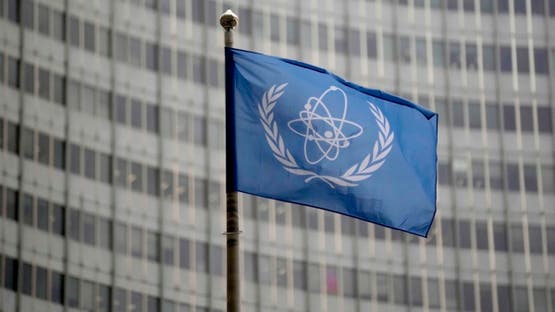 FILE - The flag of the International Atomic Energy Agency flies in front of its headquarters during an IAEA Board of Governors meeting in Vienna, Austria, Wednesday, Nov. 22, 2023. (AP Photo/Matthias Schrader, File)
