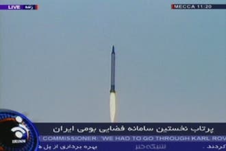 Iran fires rocket, opens first space center