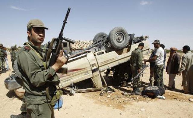 Libyan shells fall in Tunisia in new fighting between Qaddafi forces and rebels