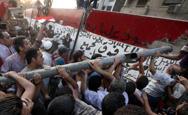 Egypt’s protesters break into Israeli embassy in Cairo and toss confidential documents
