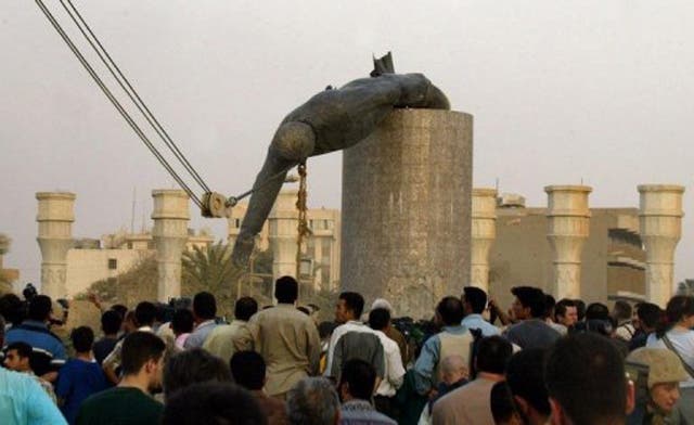 Saddam’s bronze buttock up for auction in Britain
