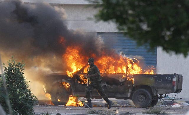 NTC says Qaddafi’s son is still at large; battles in Sirte and Bani Walid continue