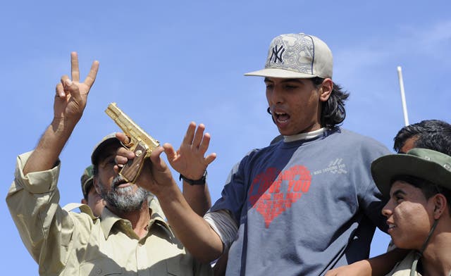 The 18-year-old man who killed Libya’s Muammar Qaddafi