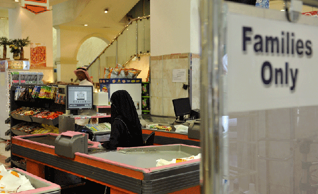 (Wo)manning the tills in Saudi Arabia: Women start work as shopkeepers