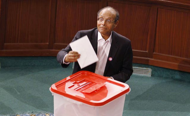 Tunisia installs former dissident Moncef Marzouki as president