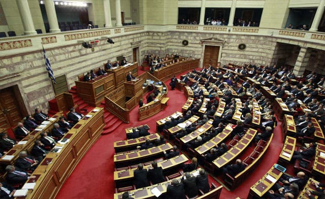 Greek government secures parliament majority to pass harsh austerity bill