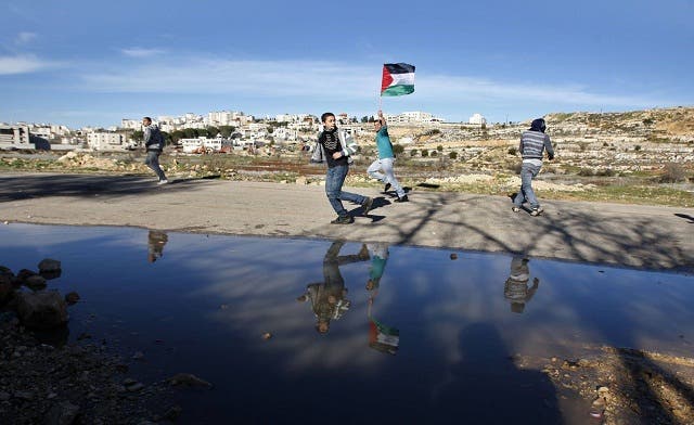 Palestinian Authority, battling debt crisis, raises taxes