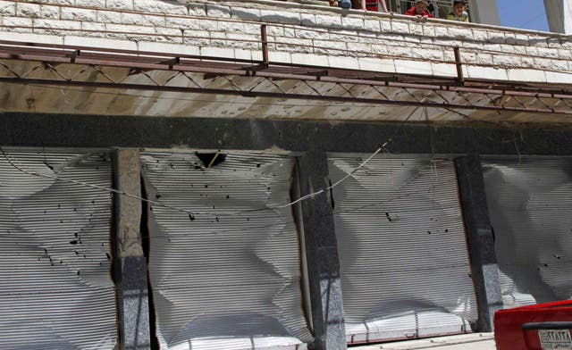Damascus merchants put up shutters in challenge to Assad