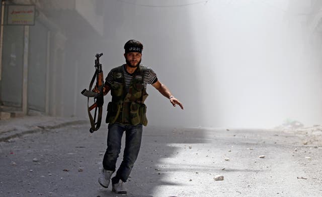 Syrian intelligence official defects as battles rage