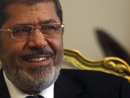مرسي يتجه إلى الصين في وفد يضم  75 رجل أعمال مصريا