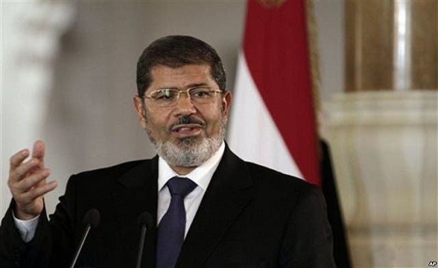 Mursi calls Egypt’s parliamentary election to begin April 27
